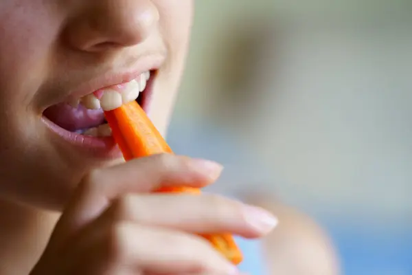 Closeup Crop Unrecognizable Young Girl Eating Fresh Carrot Slice Home Stock Photo