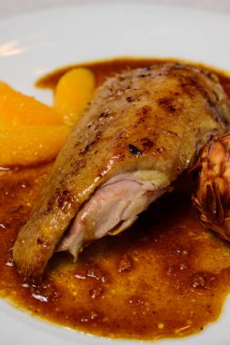 Duck a l Orange or Canard a la Bigarade Breast with Almond Croquette and Sauce clipart