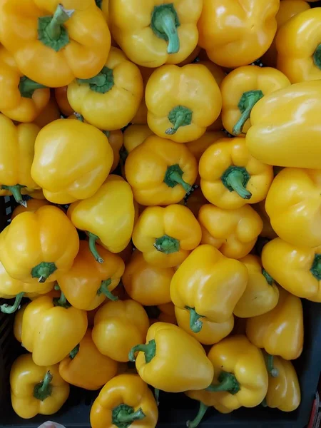 Juicy yellow peppers in a box. High quality photo