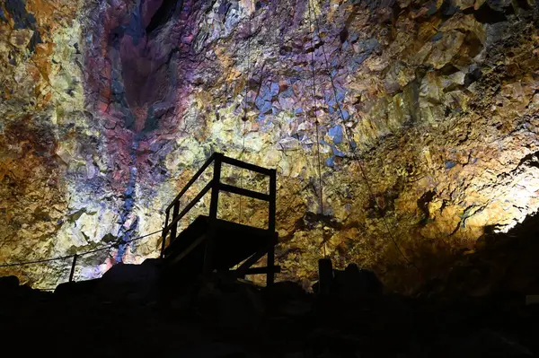 stock image Volcano magma chamber view from inside with a silhouette of the landing platform