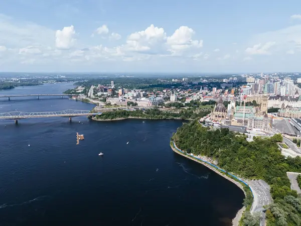 stock image Drone view of Canadian Parliament, Parliament Hill, House of Commons, and East Block in downtown of Ottawa and river in a sunny day, Canada.