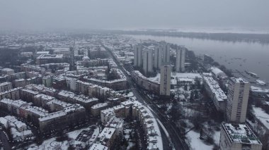 Winter cityscape, snow falling onto residential area Eastern Europe, New Belgrade, Zemun, Serbia. clipart