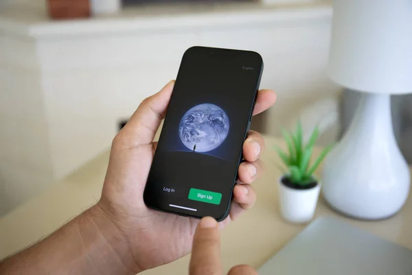 stock image Alanya, Turkey - September 18, 2023: Man hand holding iPhone 14 with social networking service messenger WeChat on the screen.