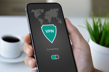 Man hand hold phone with appp Vpn created Internet protokol for protect private network over office