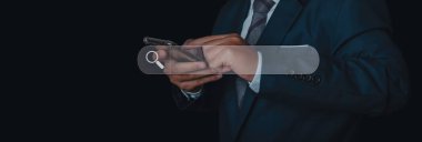 Searching browsing internet data information networking concept. Search Engine Optimization SEO Networking. Man hand presses the information search button on mobile phone touch screen, copy space.