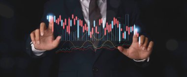 Businessman analysing forex trading graph financial data. Stock Market Investments analysis and Digital Assets. Business finance technology and investment concept.