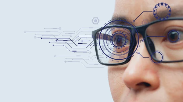 Man wearing eyeglasses with virtual screen future technology, biometric of a scientist with futuristic graphics and holography with which scans, immersive technology, metaverse universe.