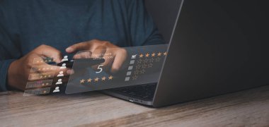 Customer satisfaction experience concept. Businessman giving high score with five golden stars rating satisfaction in service. rating very impressed. copy space.