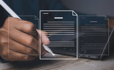 Electronic signature and paperless office concept. Businessman uses a pen sign electronic documents on a virtual screen. Business and technology document management concept.
