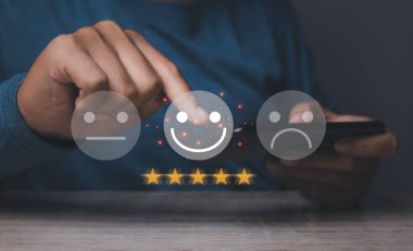 Customer satisfaction experience concept. Businessman giving high score with five golden stars rating satisfaction in service. rating very impressed. copy space.