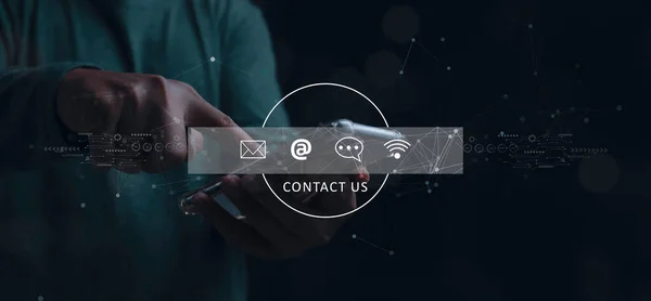 Contact us or Customer support hotline people connect. Businessman access contact connect online by smartphone with virtual screen contact icons. Customer service call center concept. copy space.