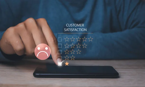 Customer satisfaction experience concept. Unhappy man Client with sadness emotion face on laptop, bad review, social media not good. User give rating to service experience online application.
