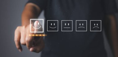 Customer satisfaction experience concept. Businessman giving high score with five golden stars rating satisfaction in service. rating very impressed. copy space.