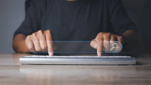 stock image Searching browsing internet data information networking concept. Search Engine Optimization SEO Networking. Man hand presses the information search button on search bar virtual screen, copy space.