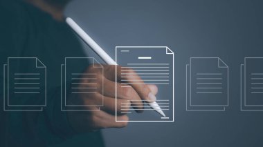 Electronic signature and paperless office concept. Businessman uses a pen sign electronic documents on a virtual screen. Business and technology document management concept.