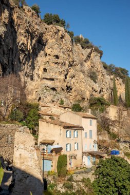 Cotignac is a French village in the Var department of the Provence Alpes Cote d'Azur region. It is famous for its troglodyte dwellings that are carved into tufa cliffs covered with large stalactites, and its two feudal towers from 1033. clipart