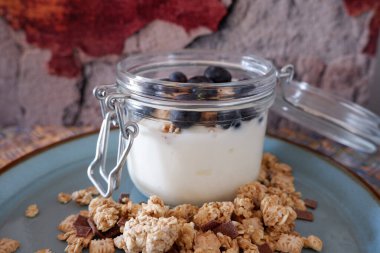 Breakfast yoghurt with cereals and blueberries