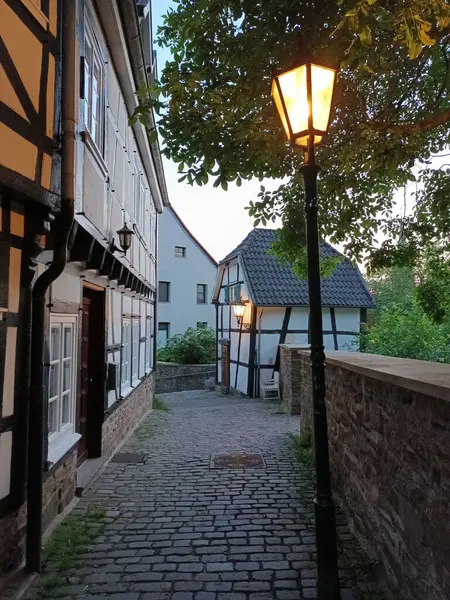 Stock image Historical narrow street with half-timbered houses and lantern in the old centre of Hattingen