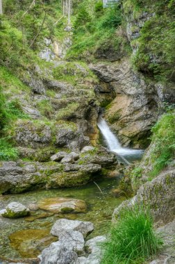 Beautiful Kuhflucht waterfalls and rocks in Farchant in Bavaria clipart