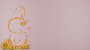 Paskalya bayramı için 3D döngü animasyonu. Pembe yüzeyde altın bir dış hat ve desen şişer. Tavşan ve Paskalya yumurtalarının üzerinde 