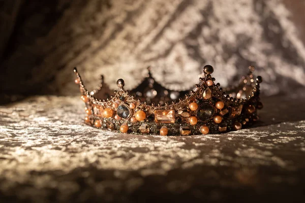 Royal crown with precious stones. Symbol of authority and wealth