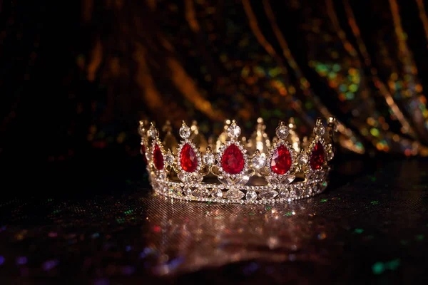 Vintage crown with red gemstones, qrystals.
