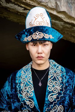 Kazakh man in national ethnic costume with chapan clipart