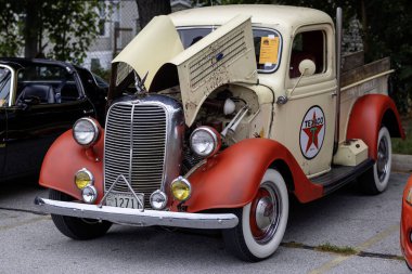 Springfield, Ohio  USA August 9 2024:  Car show, display of old historic cars and the latest luxury cars. Engines and engine parts of historic cars clipart