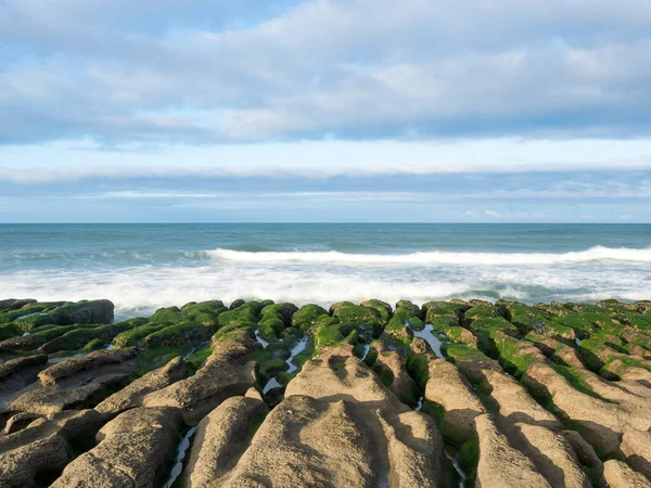 stock image LaoMei green rock troughs /The green Reef in cloudy in New Taipei City,Taiwan.