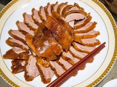 Sliced roasted duck breast in plate
