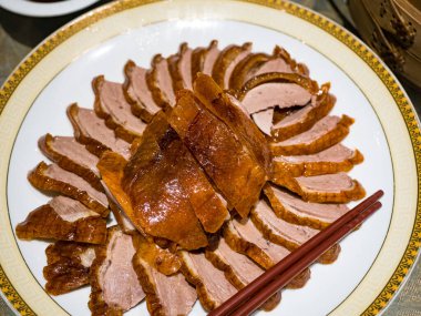 Sliced roasted duck breast in plate