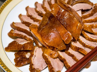 Sliced roasted duck breast in plate