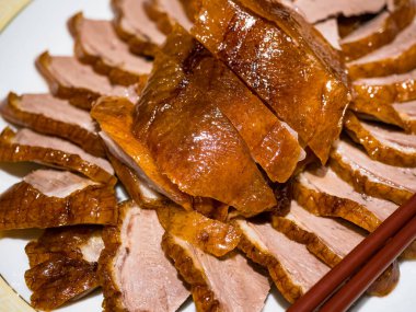 Sliced roasted duck breast in plate