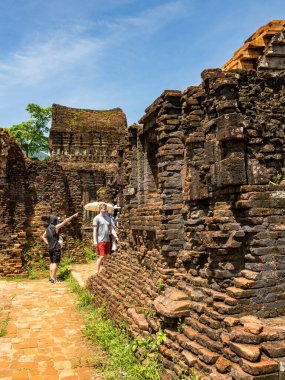 Quang Nam, VietNam - May 26,2024: tourists in My Son Sanctuary,Between the 4th and 13th centuries a unique culture which owed its spiritual origins to Hinduism developed on the coast of VietNam. clipart