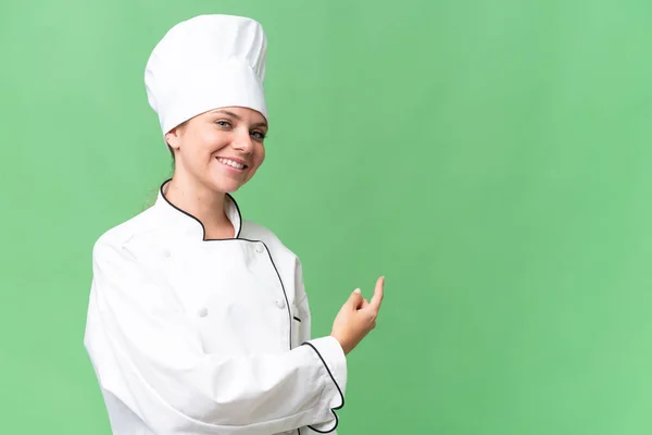 Joven Chef Mujer Sobre Aislado Verde Fondo — Foto de Stock