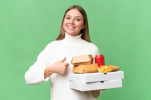 Young Beautiful Blonde Woman Holding Takeaway Food Isolated Background Giving — Stock Photo, Image
