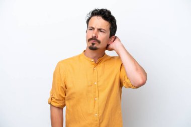 Young man with moustache isolated on white background having doubts