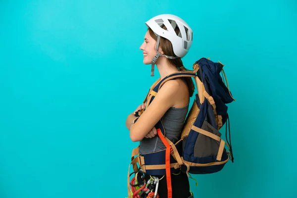 Young English Rock Climber Woman Isolated Blue Background Lateral Position — Stock Photo, Image