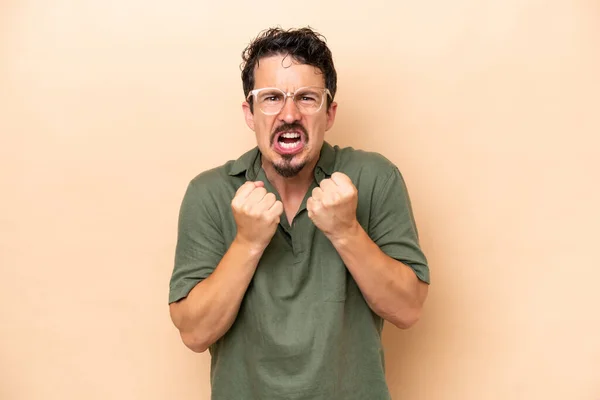 stock image Young caucasian man isolated on beige background frustrated by a bad situation