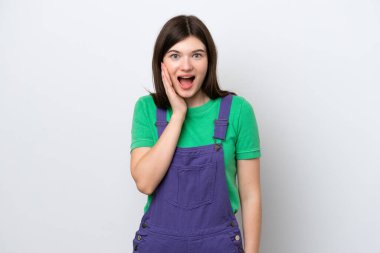 Young Russian woman isolated on blue background with surprise and shocked facial expression