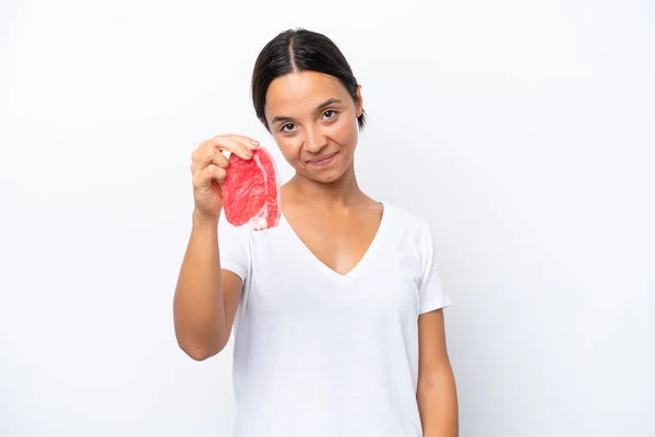 stock image Young hispanic woman holding a piece of meat isolated on white background with happy expression