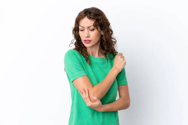 stock image Young woman with curly hair isolated on white background with pain in elbow