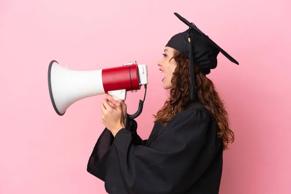 Young University Graduate Woman Isolated Pink Background Shouting Megaphone — Stockfoto