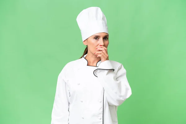 Middle Aged Chef Woman Isolated Background Having Doubts Confuse Face — Stock Photo, Image