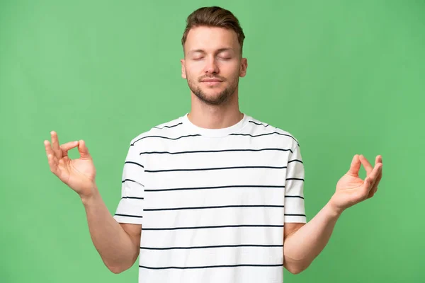 stock image Young blonde caucasian man over isolated background in zen pose