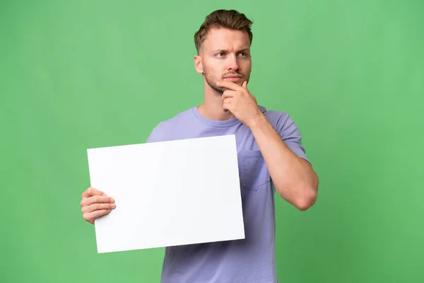 Young Blonde Caucasian Man Isolated Background Holding Empty Placard Thinking — Stock Photo, Image