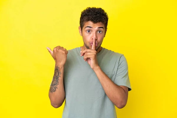 Young Handsome Brazilian Man Isolated Yellow Background Pointing Side Doing — Stock Photo, Image