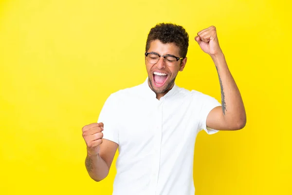 Young Handsome Brazilian Man Isolated Yellow Background Celebrating Victory — Stock Photo, Image