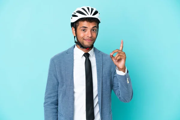 Молодий Бізнесмен Шоломом Велосипеді Ізольований Синьому Фоні Вказує Вказівним Пальцем — стокове фото