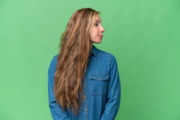 stock image Young blonde woman over isolated background looking to the side